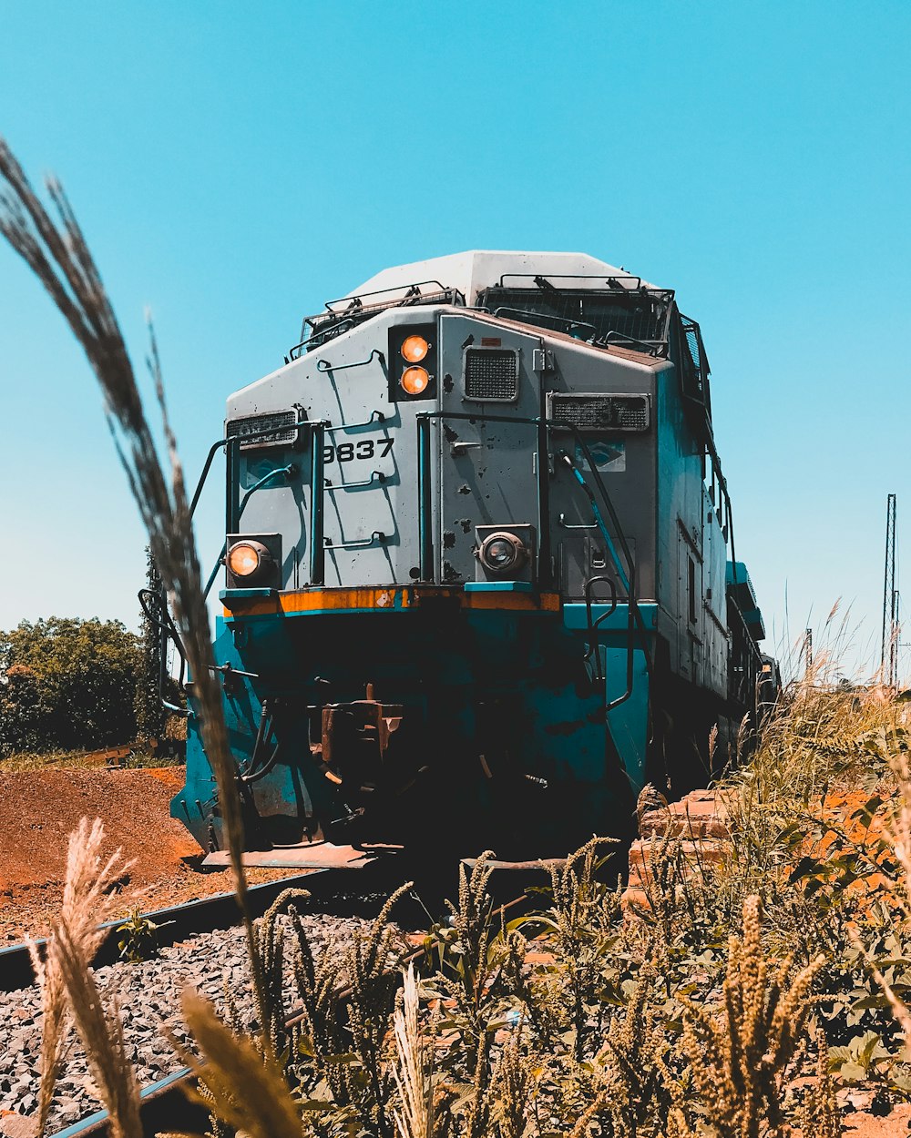 gray train under blue sky