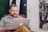man smiling and using MacBook