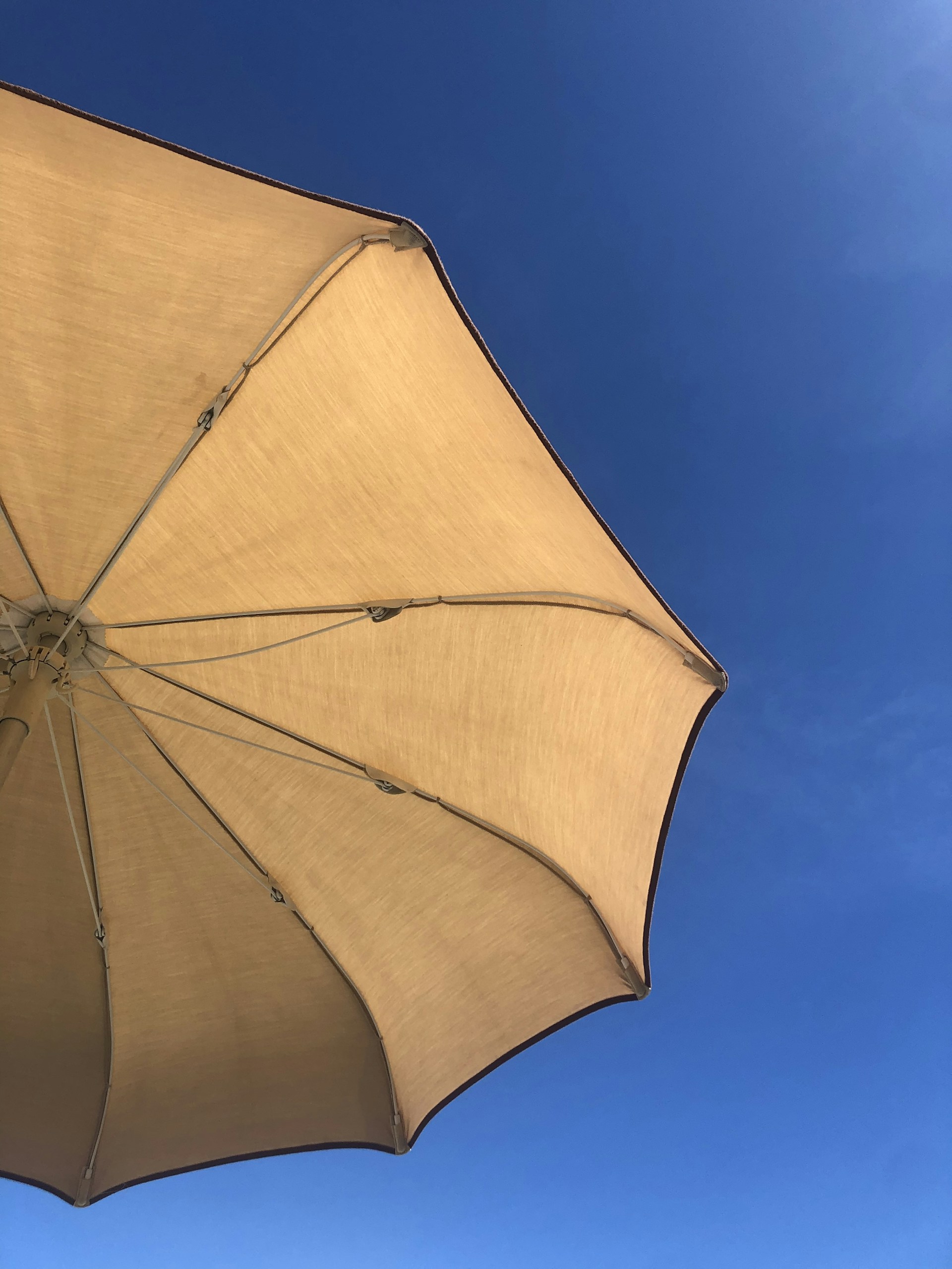 woman wearing yellow long-sleeved dress under white clouds and blue sky during daytime