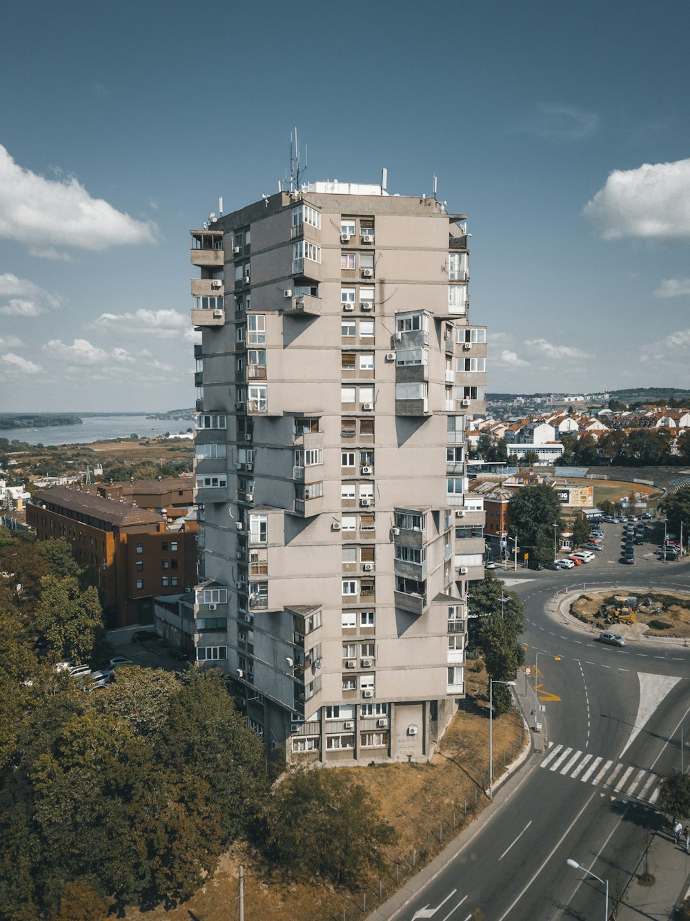 beige high-rise building under blue sky