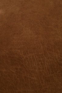Close-up of wet blue leather texture showing fine grain and color.