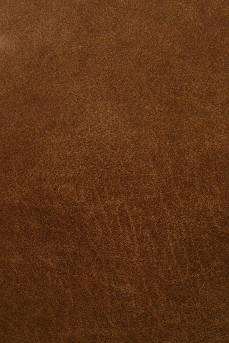 Rich brown leather surface, tight crop