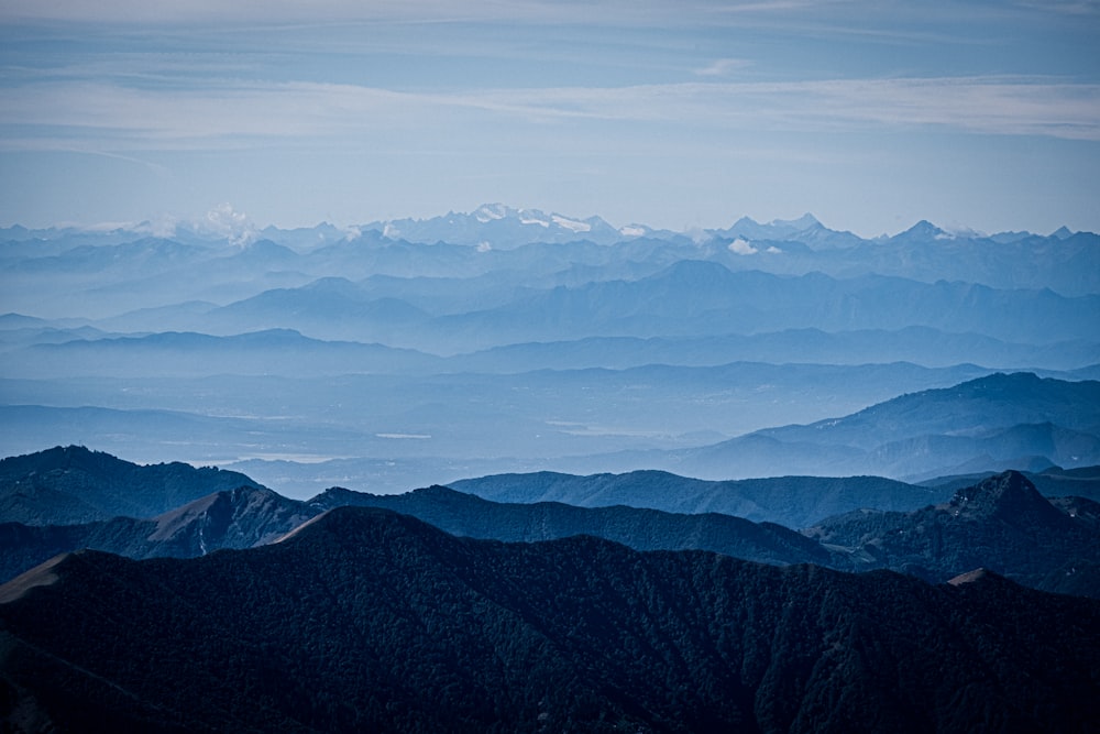 mountains under blue and grey sky