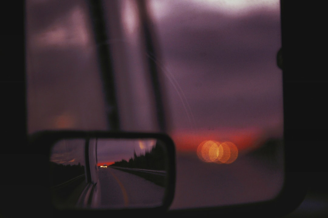 gray road view from vehicle side mirror