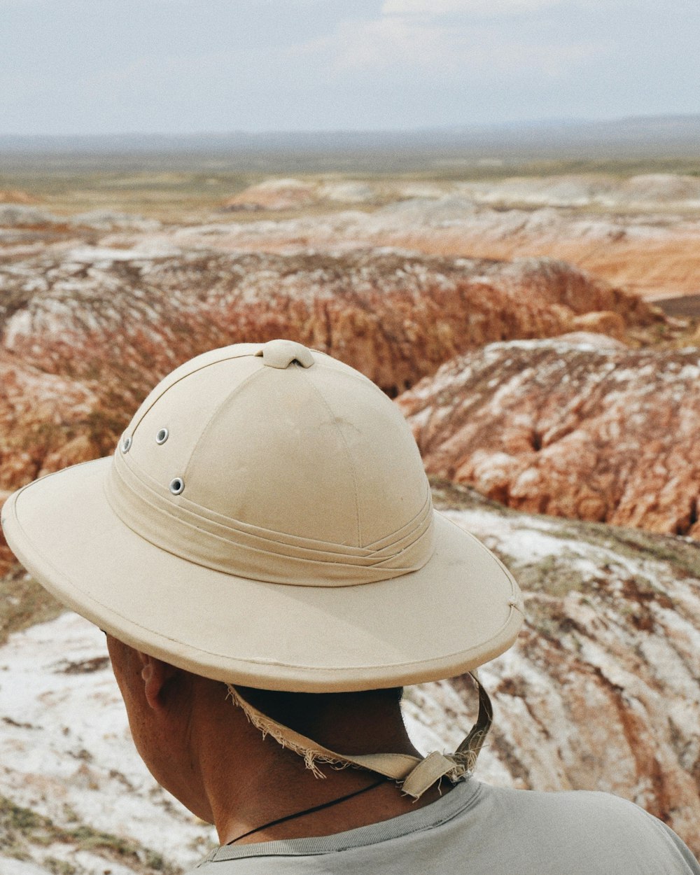 man wearing beige hat