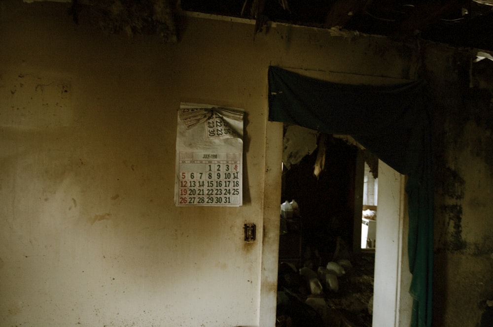 a room with a door and a sign on the wall