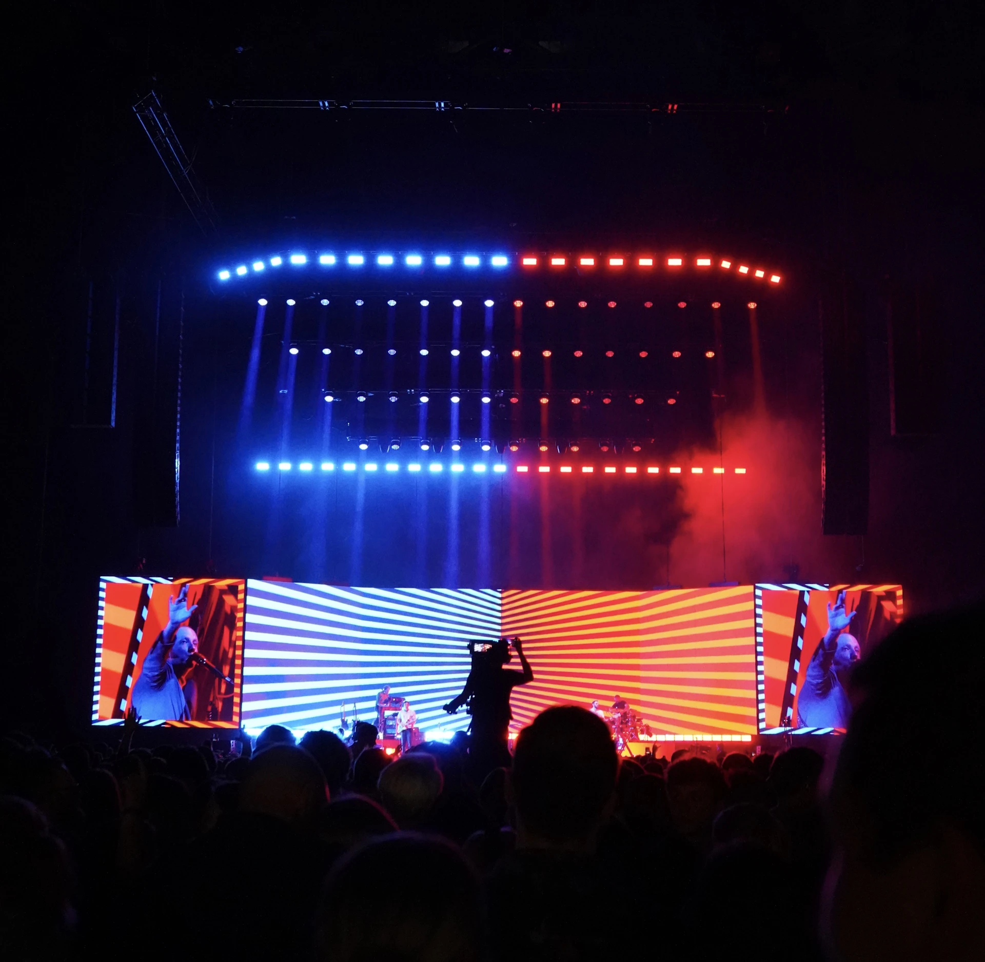 a concert scene with a person on a stage