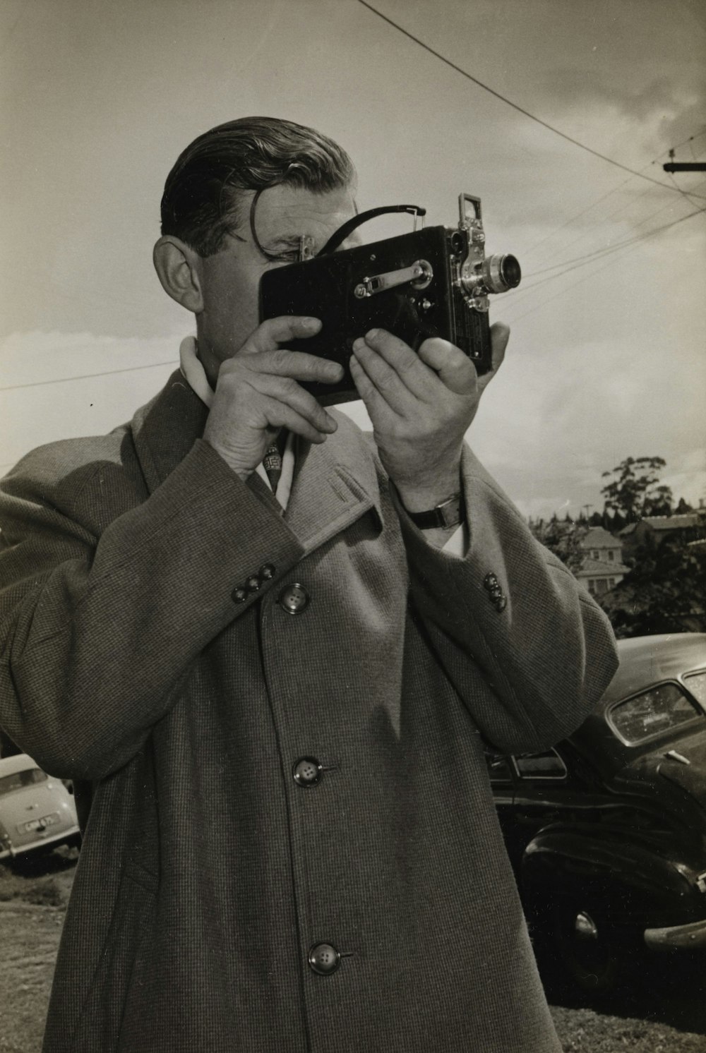 man holding black camera