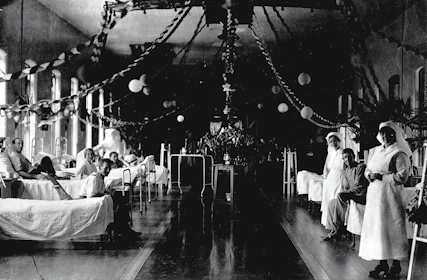 Family members receiving guidance from hospital staff in a bright, clean Indian emergency ward.