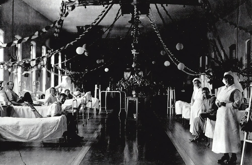 a black and white photo of nurses in a hospital