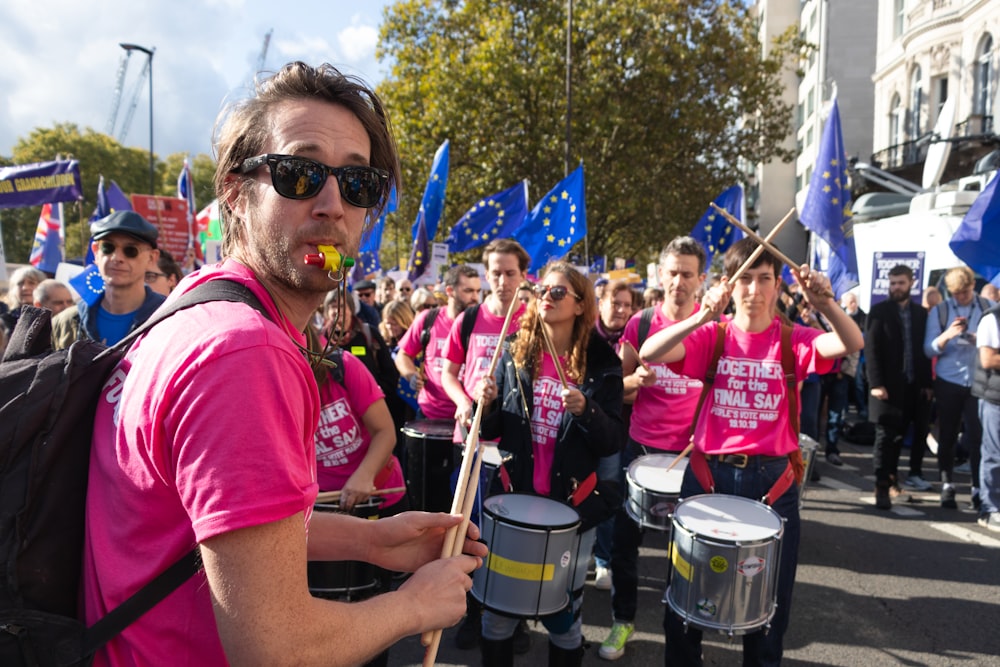 a group of people marching down a street