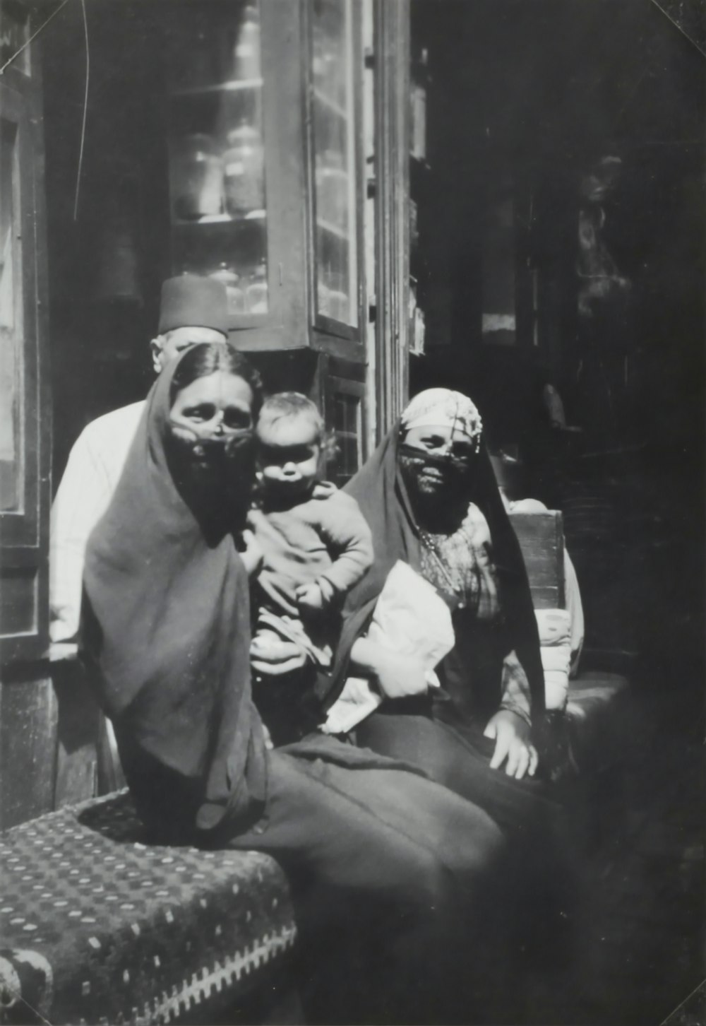 two Egyptian Women sitting on bench