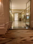 View of the hotel’s elegant hallway adorned with cream and gold accents.