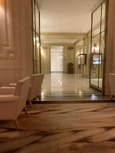 View of the hotel’s elegant hallway adorned with cream and gold accents.