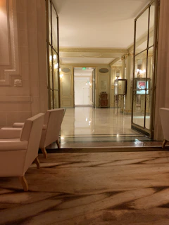 Elegant hallway with anthracite walls and warm gold accents highlighting precise craftsmanship