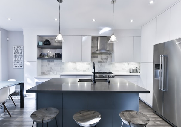 a kitchen with a center island with stools