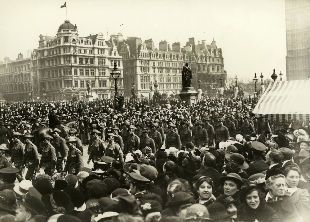 people watching soldier marching on road