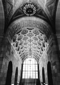 a black and white photo of a train station