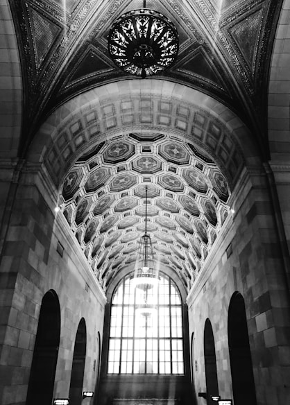 a black and white photo of a train station
