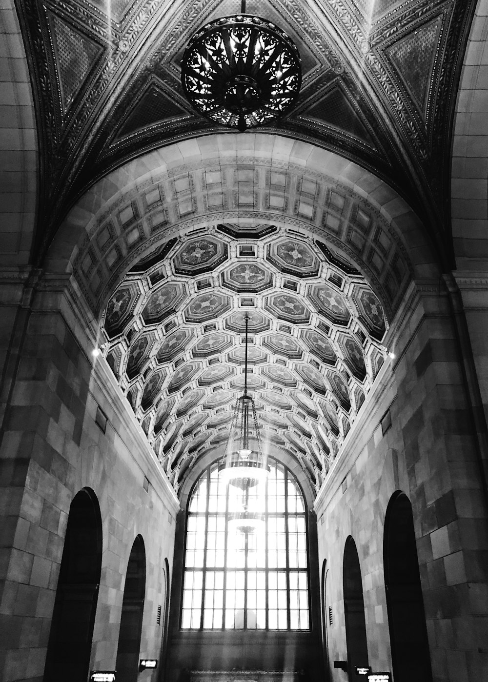 a black and white photo of a train station