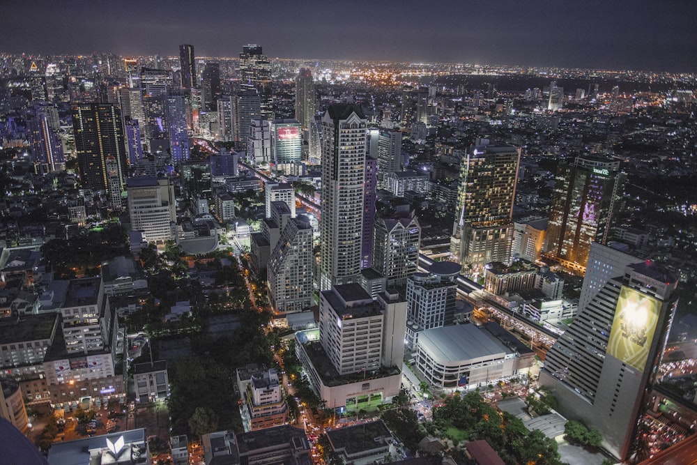 a view of a city at night from the top of a building