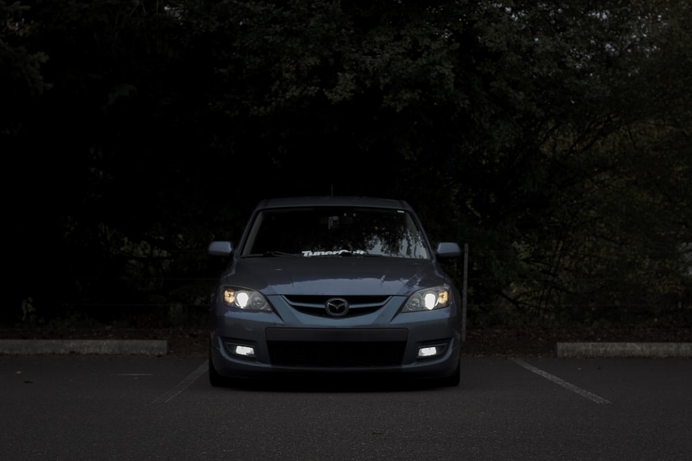 a car parked in a parking lot at night