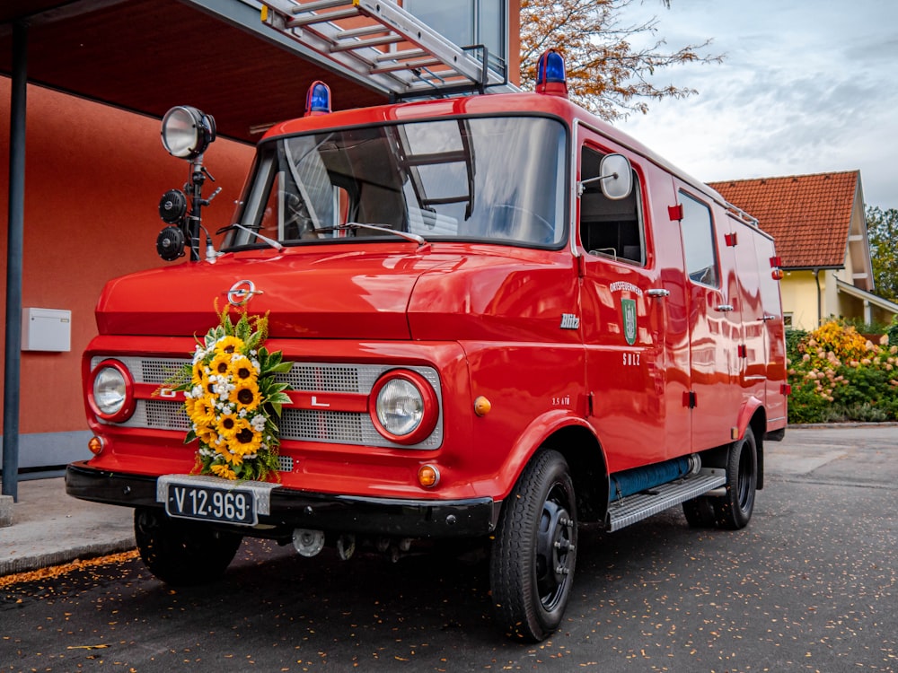 a red fire truck parked in front of a building