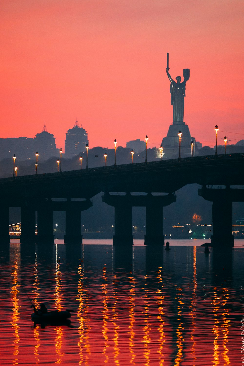 a bridge that has a statue on top of it