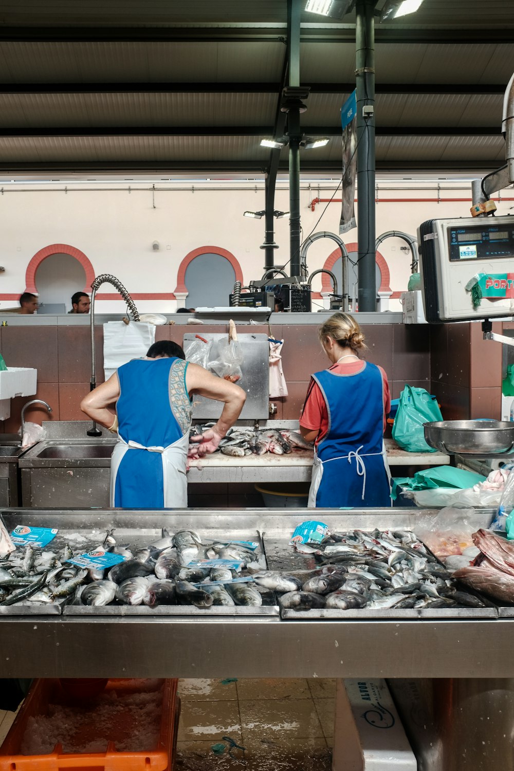 a group of people in a kitchen preparing food