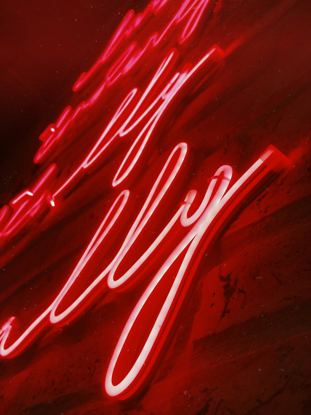 a close up of a neon sign on a building