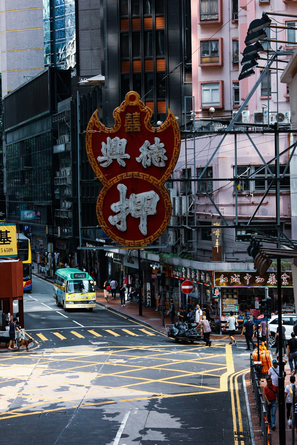 a busy city street filled with traffic and tall buildings