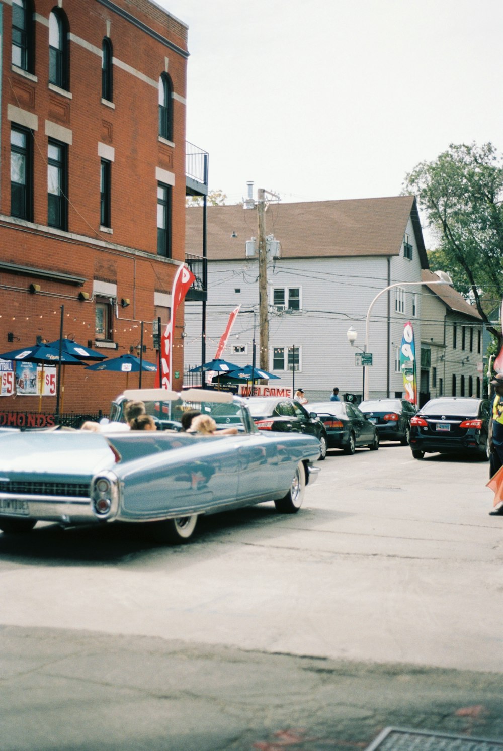 an old car parked on the side of the road