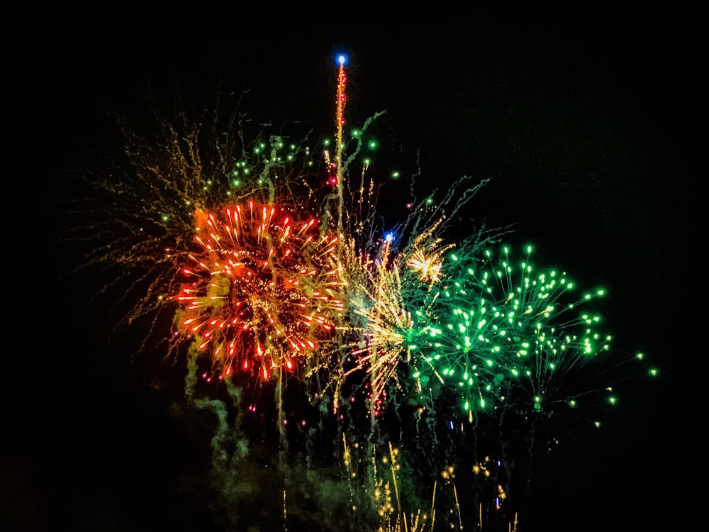 a bunch of fireworks are lit up in the night sky