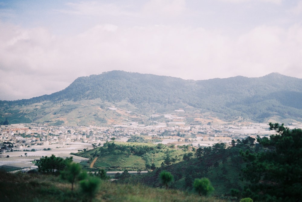 a view of a city with mountains in the background