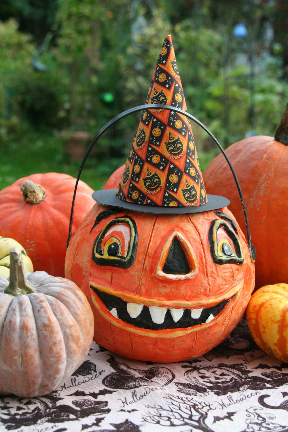 a group of pumpkins with faces painted on them