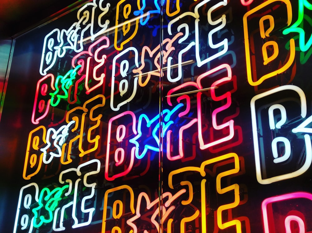 a close up of a neon sign on a building