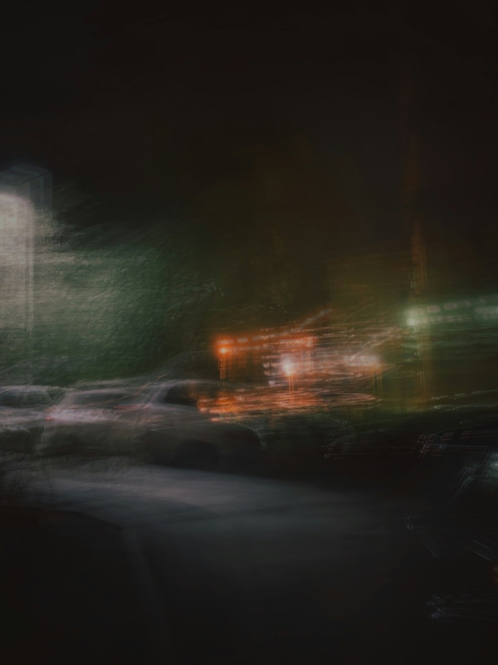 a blurry photo of a city street at night