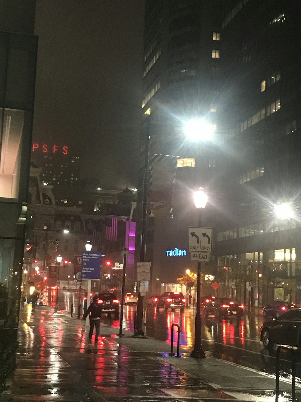 a city street at night in the rain