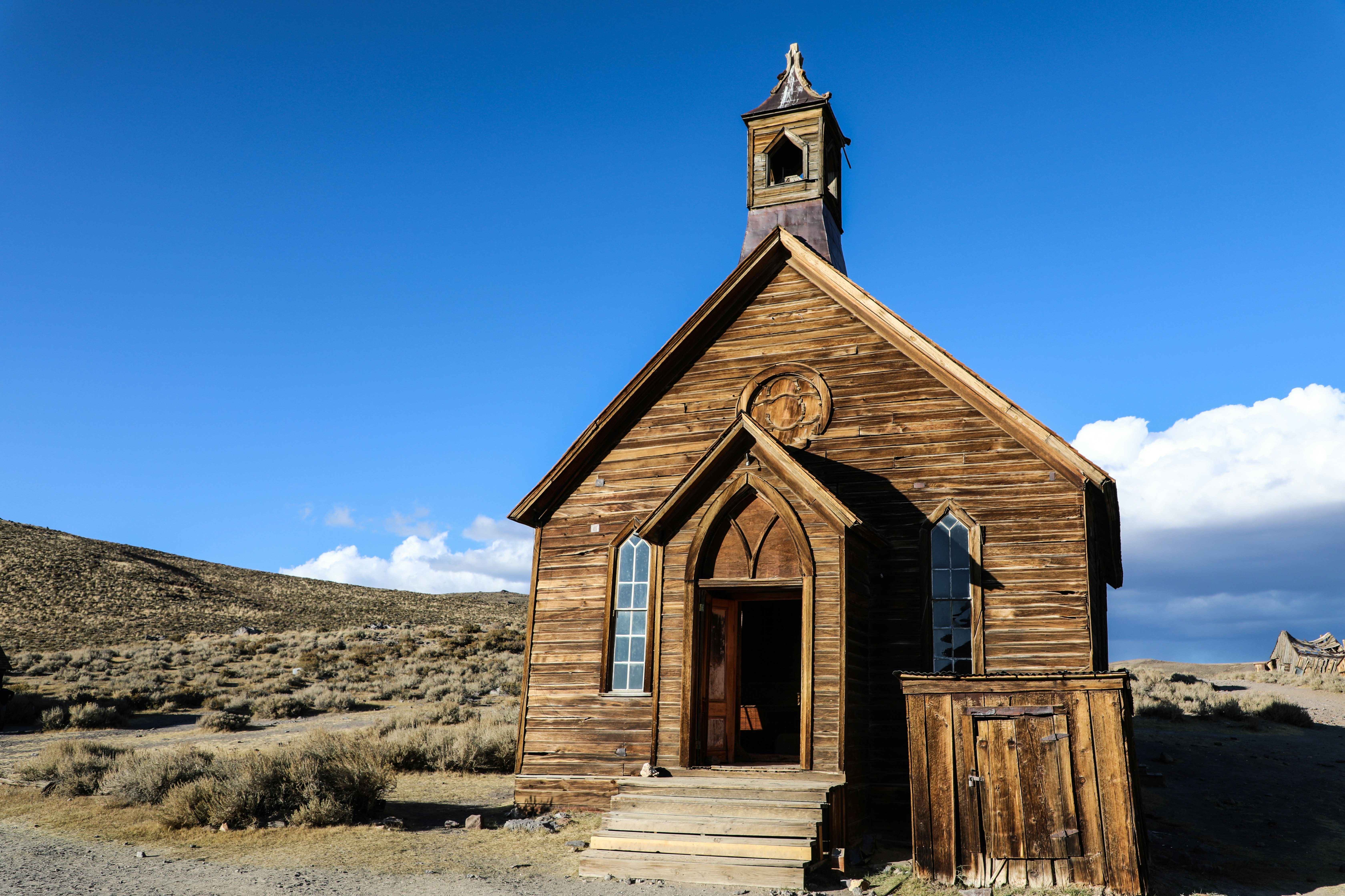 brown wooden chapel in the desert