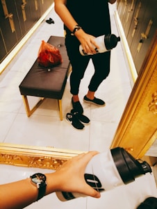 A candid shot of a creator mid-workout, dressed sharply, with grooming products and cologne nearby.