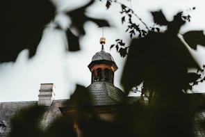An elegant custom cupola crowning a charming home roof.