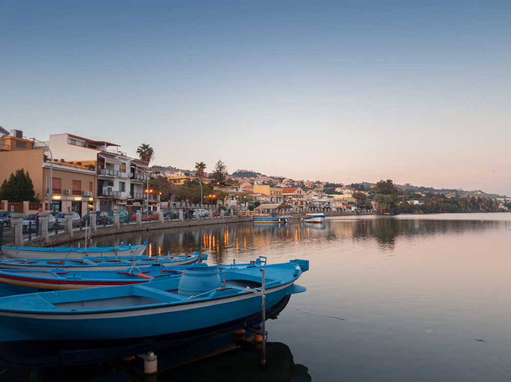 white boats on body of water during daytime