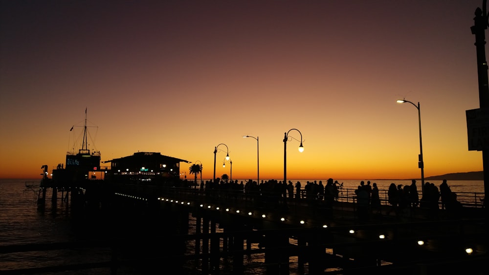 silhouette of lights under orange sky