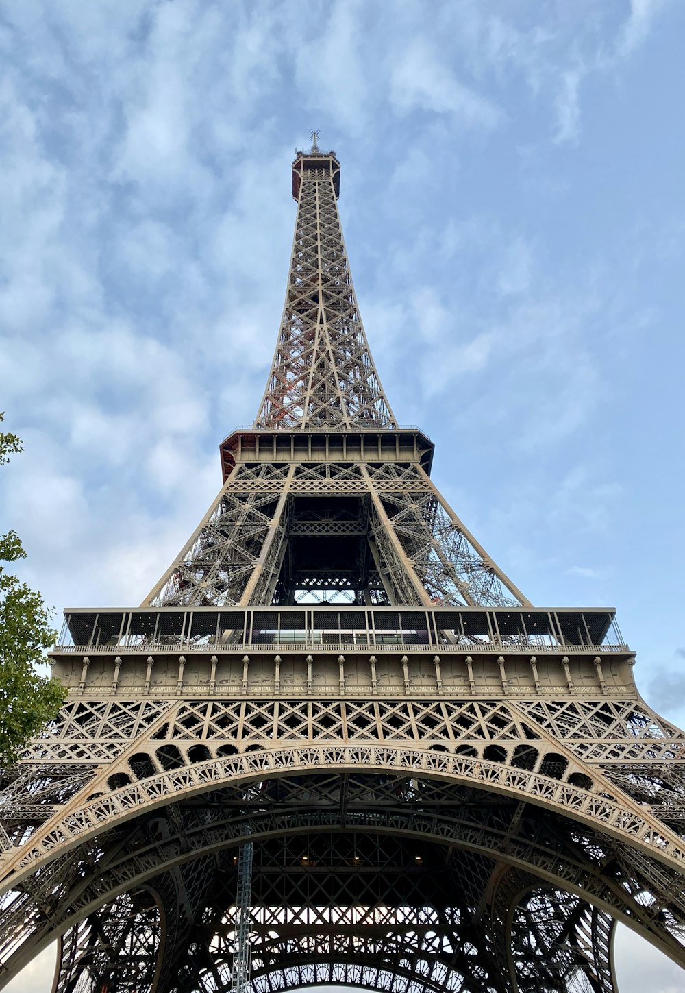 low-angle photography of Eiffel Tower in Paris France under blue and white sky during daytime