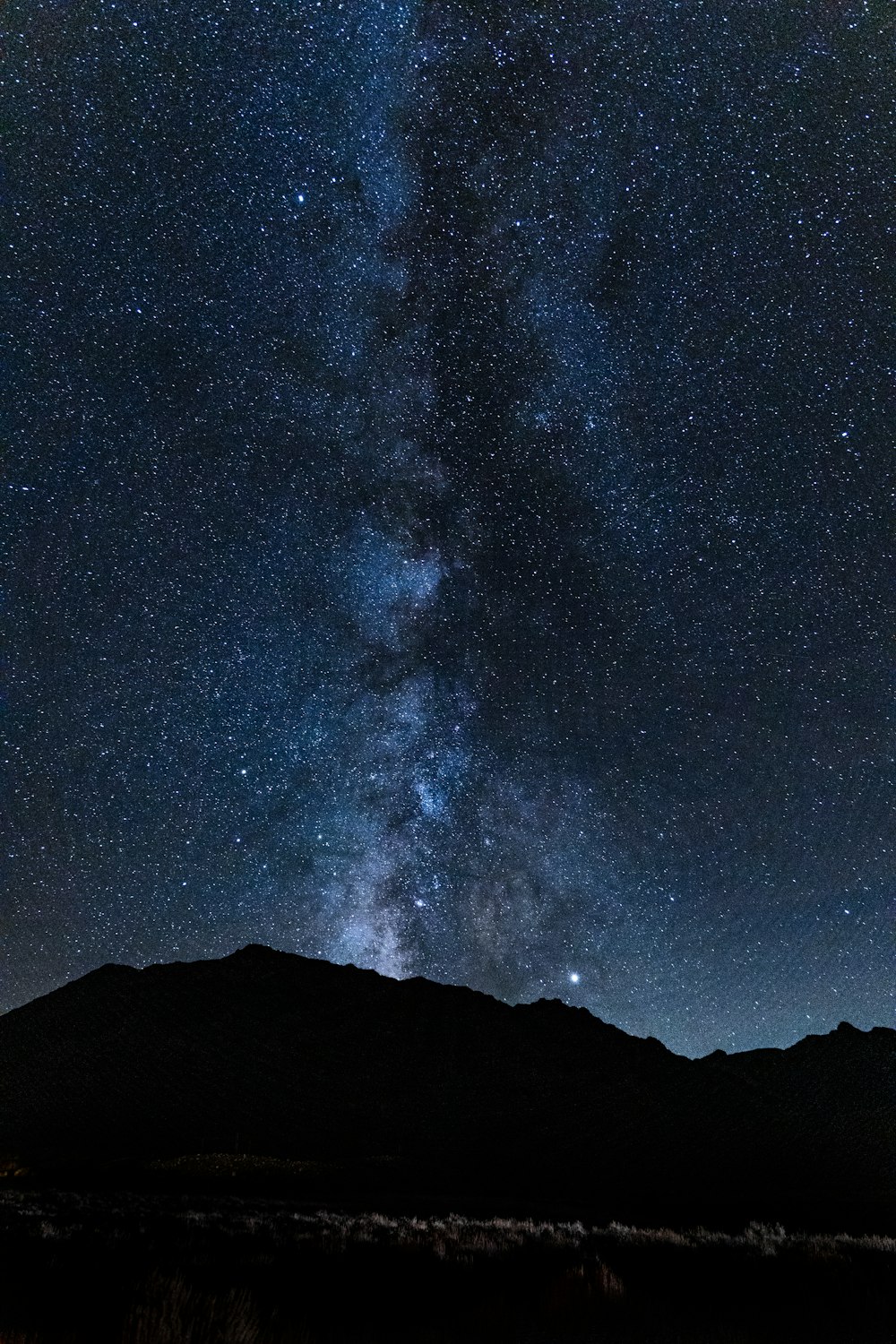 silhouette photography of mountain at night