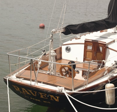 black and brown boat on the ocean