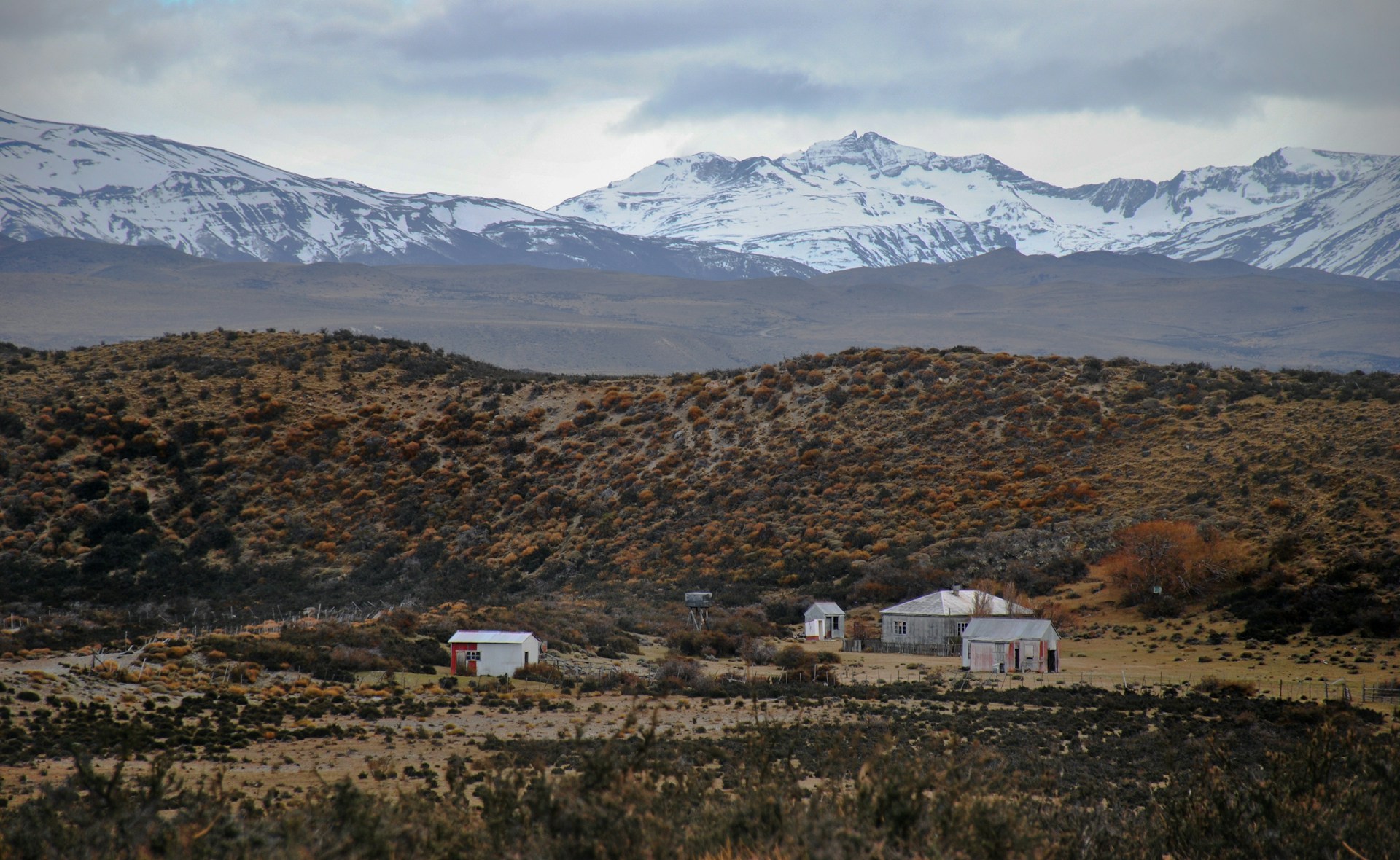 white concrete houses beside mountain