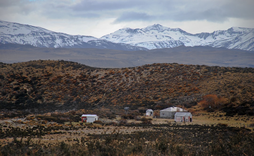 white concrete houses beside mountain, The Patagonia quiet life