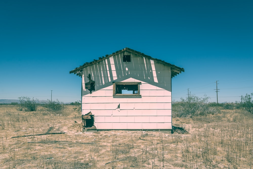 white and gray wooden house during daytime