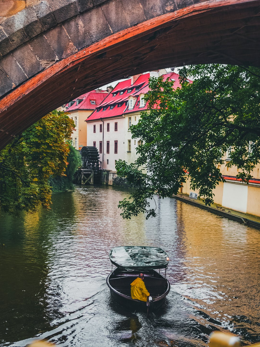 man riding on brown boat